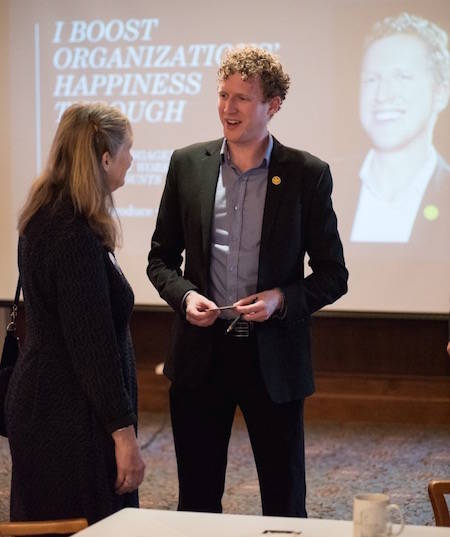 Chris Butsch speaking at a business event.